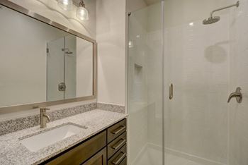 Standup frameless tiled showers in select homes